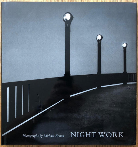 The photography book cover of Night Work by Michael Kenna. hardback with image of 3 lamposts. Signed.