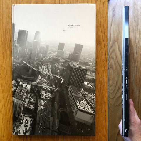 The photography book cover of LA Day, LA Night by Michael Light. Hardback with aerial view of a motorway running through a city.