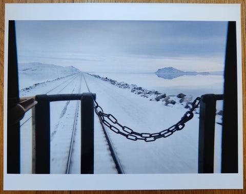 The photography cover of August 29th - September 8th 2012 by Mike Brodie. Hardback book with signed print. Image of snowy landscape from the back of a train.