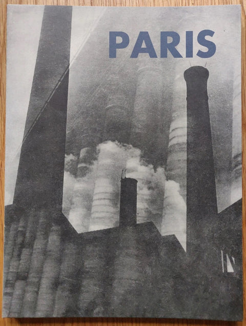 The photography book cover of Paris by Moi Ver. Paperback with B&W cover and blue title.