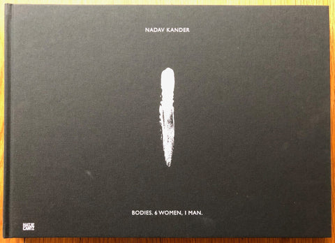 The photography book cover of Bodies 6 Women 1 Man by Nadav Kander. Hardback in black with white text.