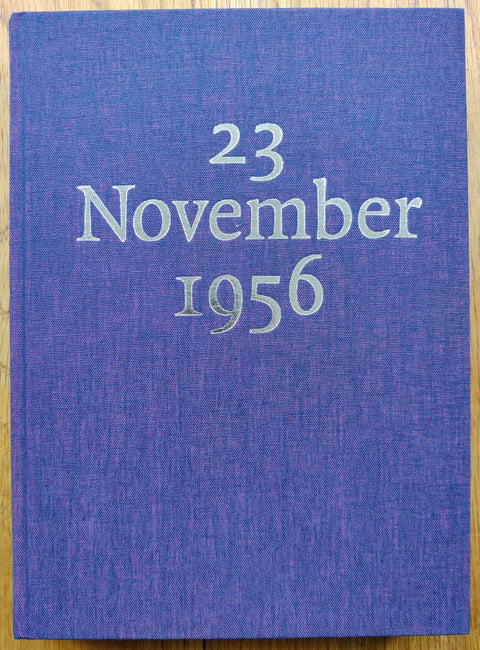 The photography book cover of Weathering Time by Nancy Floyd. Hardback in purple with silver "23 November 1956".