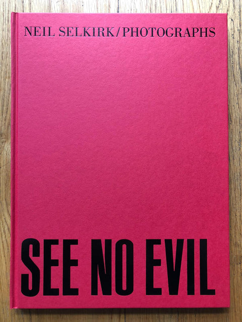 The photography book cover of See No Evil by Neil Selkirk. Hardback in red.