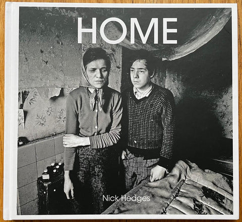 The photography book cover of Home by Nick Hedges. Hardback in B&W. Signed.
