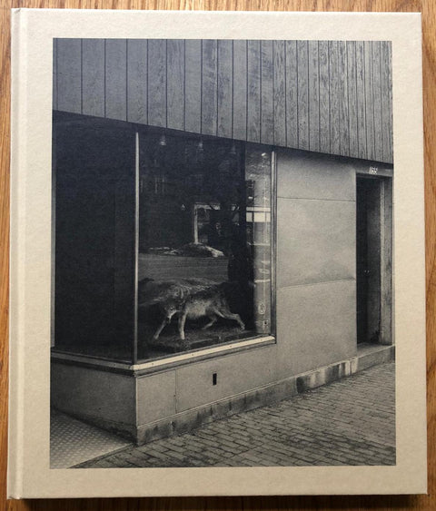 The photography book cover of The Local by Nick Meyer. Hardback in sepia. Signed.