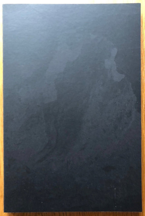 The photography book cover of Nothing but Clouds by Kristina Jurotschkin. Paperback black cover.