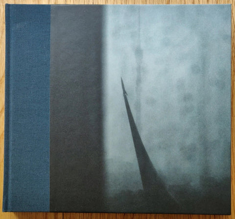 The photography book cover of Signal & Rauschen | Signal & Noise by Oliver Krebs. Hardback with dark blue binding.
