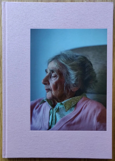 The photography book cover of Mother by Paul Graham. Hardback in pink with cover image of an elderly woman.