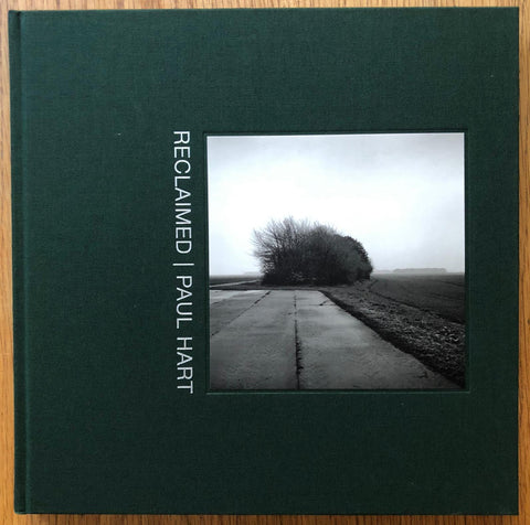 The photobook cover of Reclaimed by Paul Hart. Hardback in dark green. Signed.