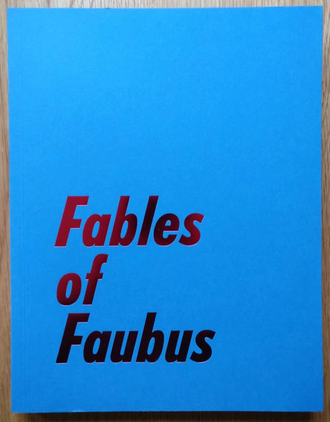 The photography book cover of Fables of Faubus by Paul Reas. Hardback blue cover with red shiny title.