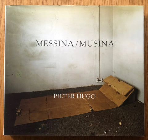 The photography book cover of Messina / Musina by Pieter Hugo. Hardback with image of cardboard laid out on the floor. Signed.