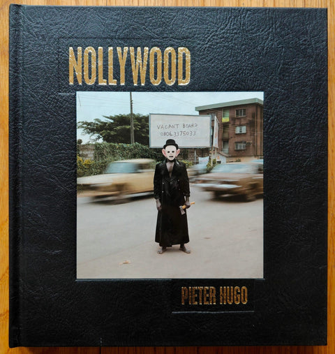 The photography book cover of Nollywood by Pieter Hugo. Hardback in black. Signed.