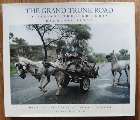 The photography book cover of The Grand Trunk Road: A Passage Through India by Raghubir Singh. In dust jacketed hardcover grey.