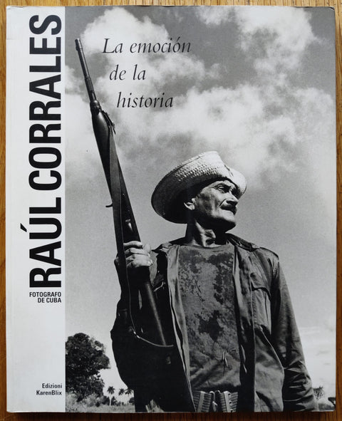The photography book cover of La emocion de la historia by Raul Corrales. In softcover white.