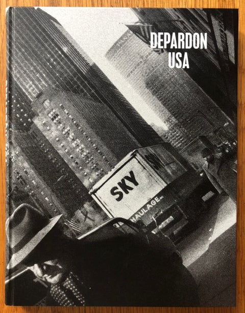 The photography book cover of Depardon - USA by Raymond Depardon. Hardback with B&W image of a "SKY" van.