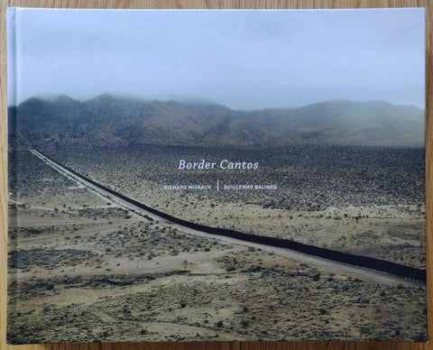 The photography book cover of Border Cantos by Richard Misrach. Hardback with cover image of a desert/vast landscape.