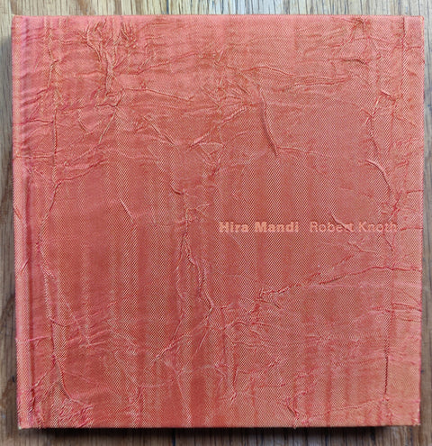 The photography book cover of Hira Mandi by Robert Knoth. Hardback with textured red cover.