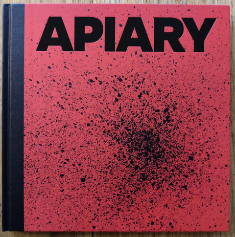 The photography book cover of Apiary by Robin Friend. In hardcover red with black spine.