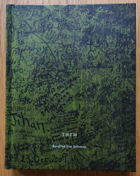 The photography book cover of Them by Rosalind Fox Solomon. In hardcover green.