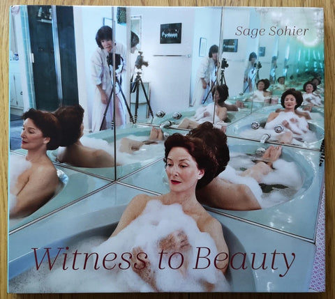 The photography book cover of Witness to Beauty by Sage Sohier. Hardback with cover image of a woman in a bath in a mirrored room.