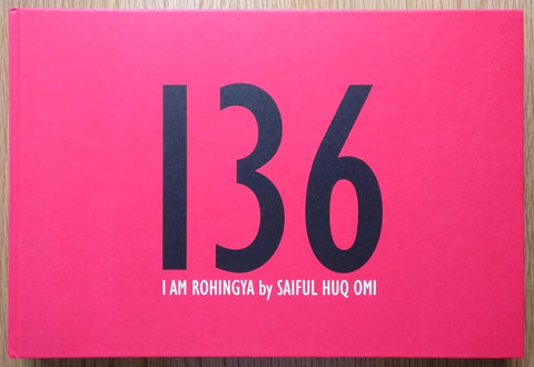 The photography book cover of 136 I am Rohingya by Saiful Huq Omi. Hardback cover in hot pink with large 136.