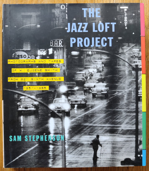 The photography book cover of Stock Image The Jazz Loft Project: Photographs and Tapes of W. Eugene Smith from 821 Sixth Avenue, 1957-1965 by Sam Stephenson. In dust jacketed hardcover black.