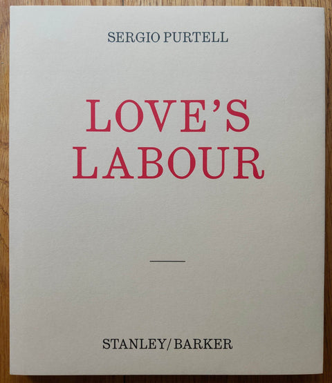 The photography book cover of Love's Labour by Sergio Purtell. Hardback in white with red title.