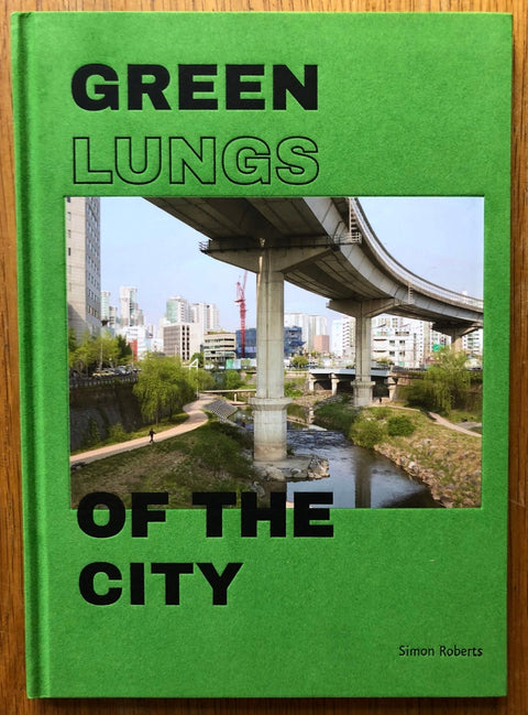 The photography book cover of Green Lungs of the City by Simon Roberts. Hardback in green.