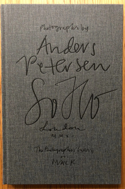 The photobook cover of Soho by Anders Petersen. Hardback in grey.
