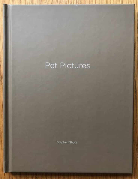 The photobook cover of Pet Pictures by Stephen Shore. Hardback in grey/brown. Signed.