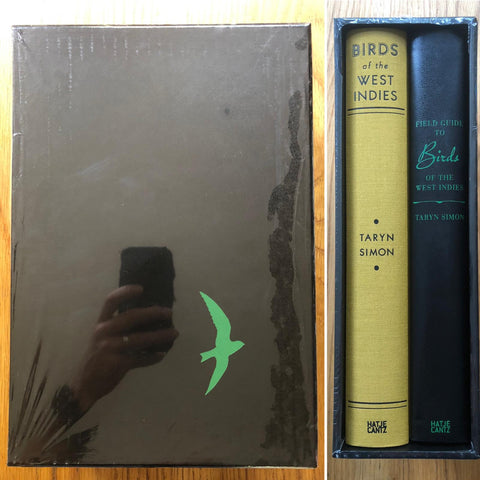 The photography book cover of Birds of the West Indies and Field guide to Birds of the West Indies by Taryn Simon. Two books - both hardback, one black and one yellow in a black slipcase. Signed.