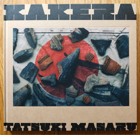 The photography book cover of KAKERA by Tatsuki Masaru. Hardback with light brown border.