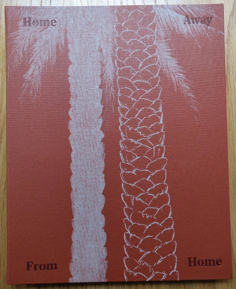The photography book cover of Home Away From Home by Taysir Batniji. Paperback in red with sketch of palm trees on the cover.