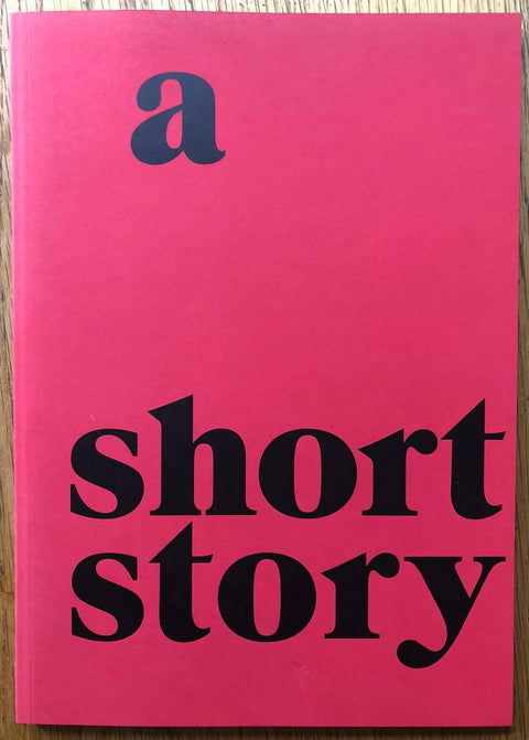 The photography book cover of A Short Story by Thomas Boivin. Paperback in red with large title in black.