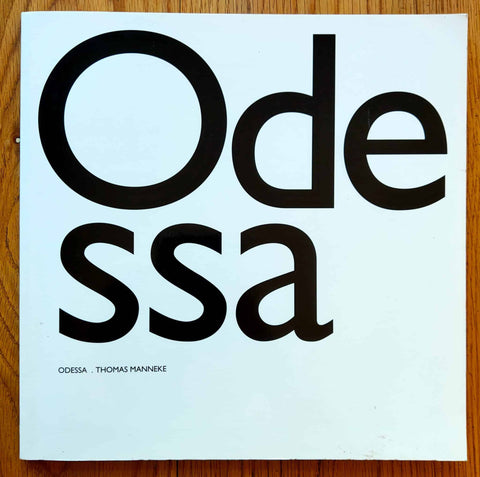 The photography book cover of Odessa by Thomas Manneke. Paperback in white with large black title.