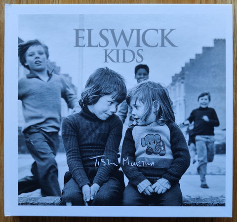 The photography book cover of Elswick Kids by Tish Murtha. In hardcover white with two kids.