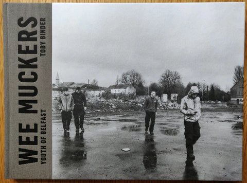 The photography book cover of Wee Muckers by Toby Binder. Hardback in black and white with image of four young people on the street.