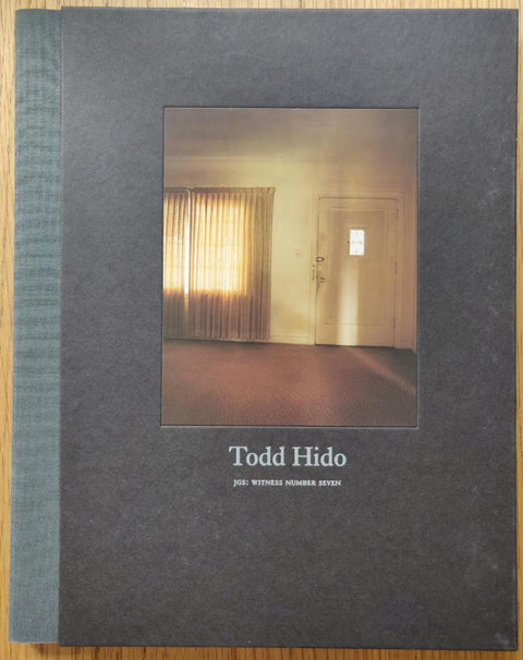 The photography book cover of JGS: Witness Number Seven by Todd Hido. Hardback with image of an empty room in the centre.