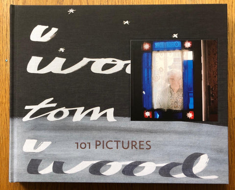 The photography book cover of 101 Pictures by Tom Wood. Hardback in black and grey. Signed.