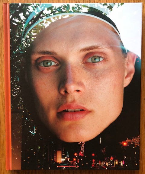 The photography book cover of The Model by Torbjorn Rodland. Hardback with a close up photograph of a face.