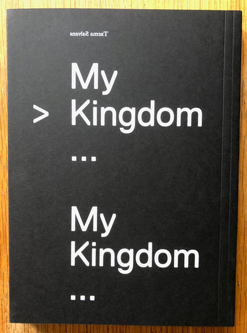 The photography book cover of My Kingdom by Txema Salvans. Paperback in black with white text.