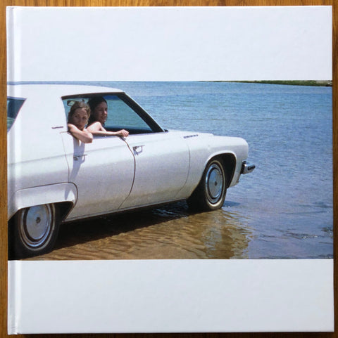 The photography book cover of Deuce and a Quarter by Vinca Petersen. Hardback with image of a car in water.