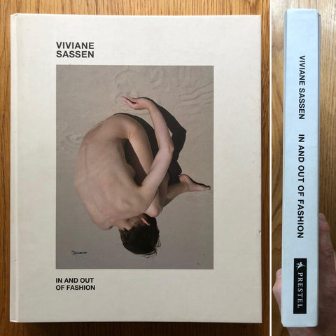 The photobook cover of In and Out of Fashion by Viviane Sassen. IN hardcover white. Signed.