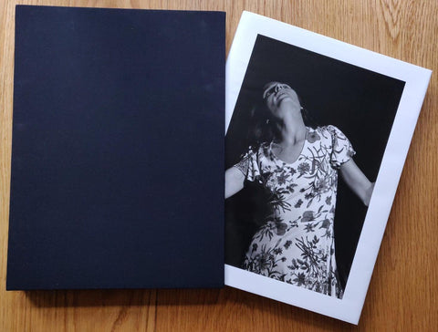The phootgraphy book cover of 5x7 by William Eggleston. In hardcover slipcase black. Numbered and signed.
